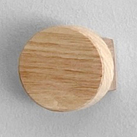 Wooden knob on a gray background