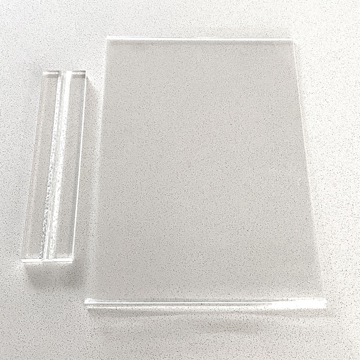 Clear Acrylic Photo Frame with Clear Base, showing all components laid flat on table