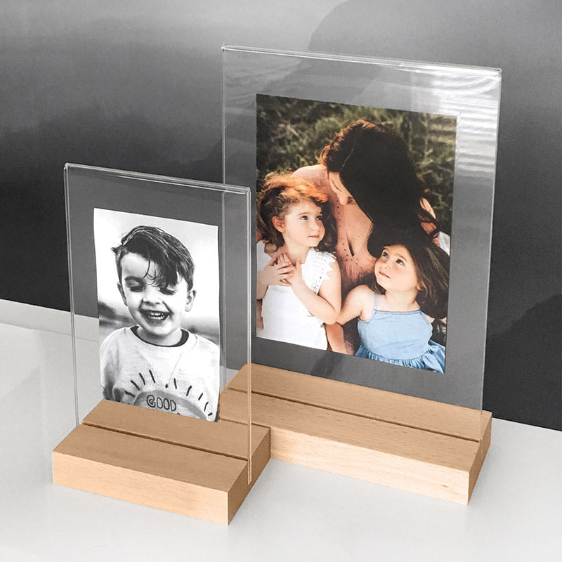 Clear Acrylic Photo Frames with Natural Wood Base, showcasing some family photos inside