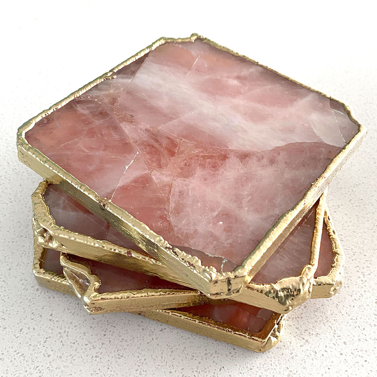 Agate Gold Edged Coasters in Rose Quartz. Set of 4 stacked on top of each other.
