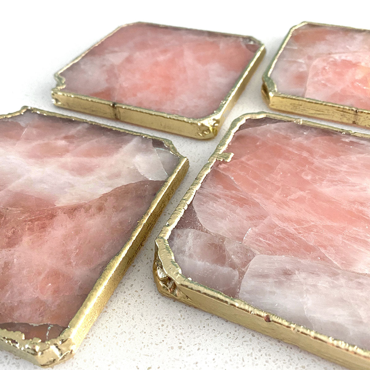 Agate Gold Edged Coasters in Rose Quartz. Set of 4. Flat lay view.