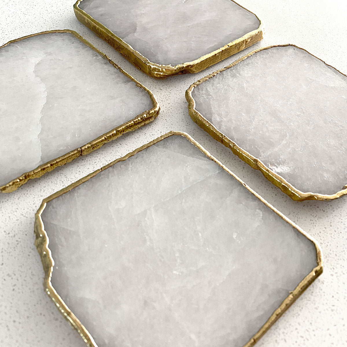 Agate Gold Edged Coasters in White Agate. Set of 4. Flat lay view.