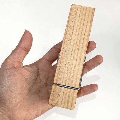 Large Wood Spring Clip tea towel holder held in a hand to show scale