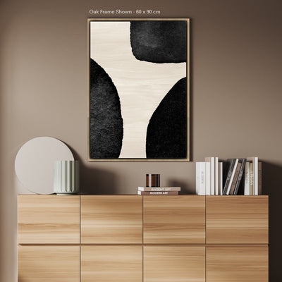 Large framed canvas shown in a home on a wall, in an oak coloured frame