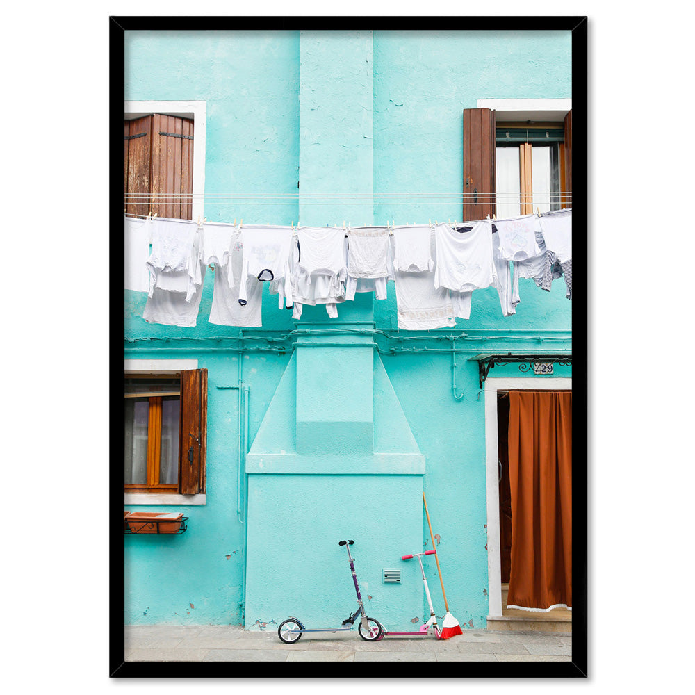 Turquoise Terrace Washing Burano - Art Print by Victoria's Stories, Poster, Stretched Canvas, or Framed Wall Art Print, shown in a black frame
