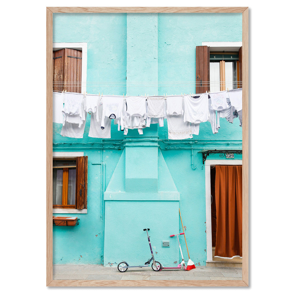 Turquoise Terrace Washing Burano - Art Print by Victoria's Stories, Poster, Stretched Canvas, or Framed Wall Art Print, shown in a natural timber frame