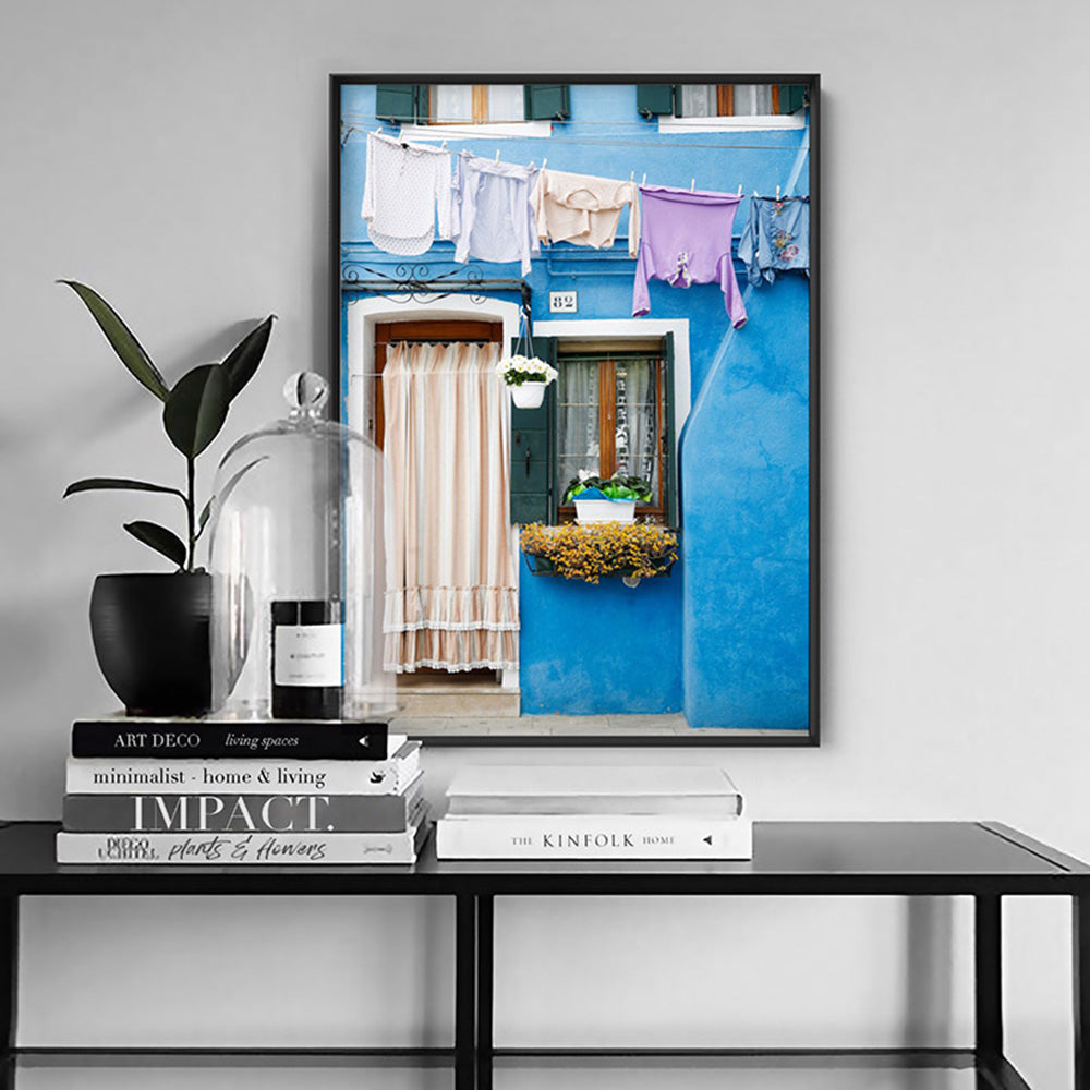 Bright Blue Terrace Washing Burano - Art Print by Victoria's Stories, Poster, Stretched Canvas or Framed Wall Art Prints, shown framed in a room