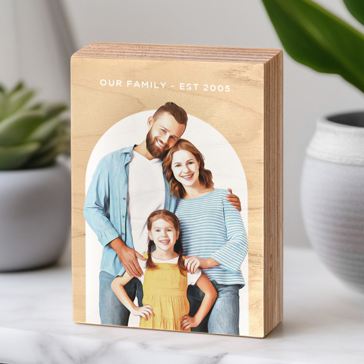 Family Portrait Painting on Wood Photo Block on a table in a home next to some home decor items