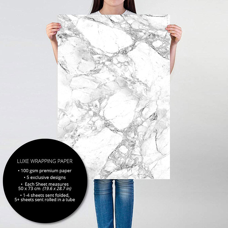 Person holding White Marble gift wrapping paper