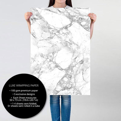 Person holding White Marble gift wrapping paper