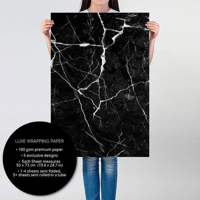 Person holding Black Marble gift wrapping paper